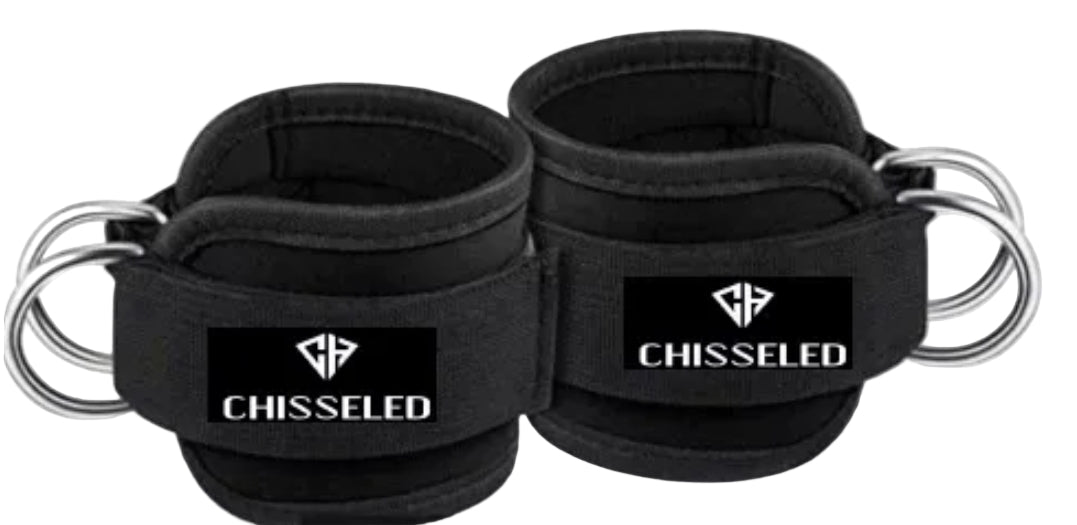 Black wrist wraps with 'Chisseled' branding on a white background